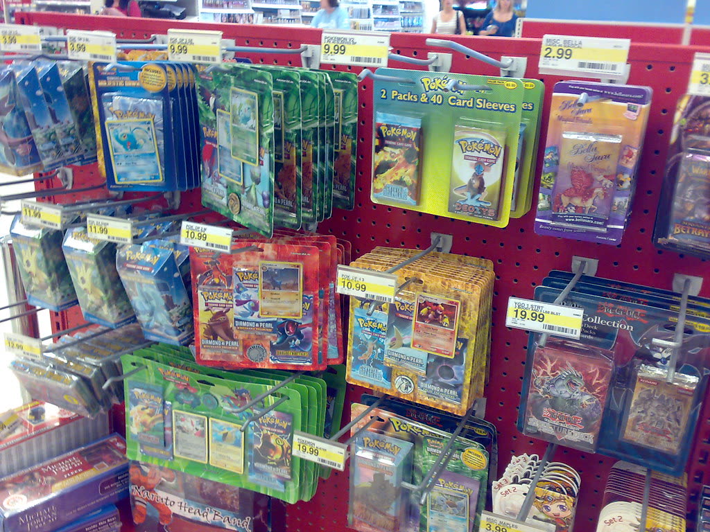 Retail wall of sealed Pokémon card packs and boxed products